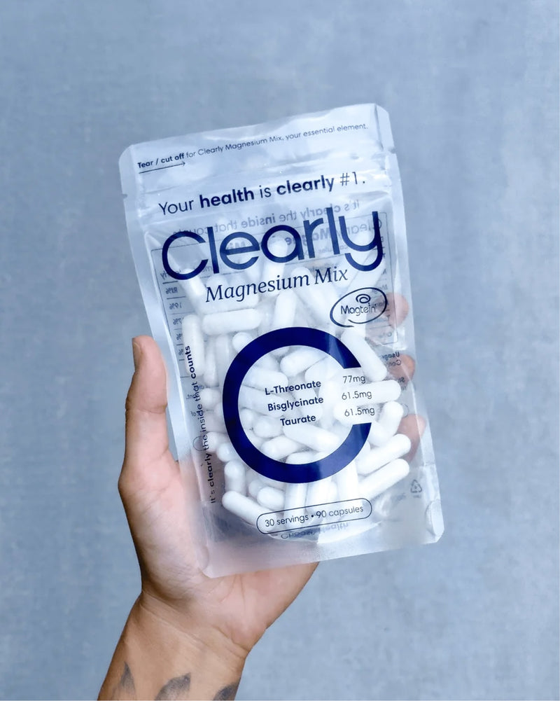 Clearly Magnesium Mix supplement in a clear bottle with a white label, showing the colorful powder inside.